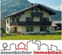 Foto mit Logo - Eine besondere Lage, Zweifamilienhaus mit ausgebautem Dachboden, Berg- und Weitblick in Ruhpolding!